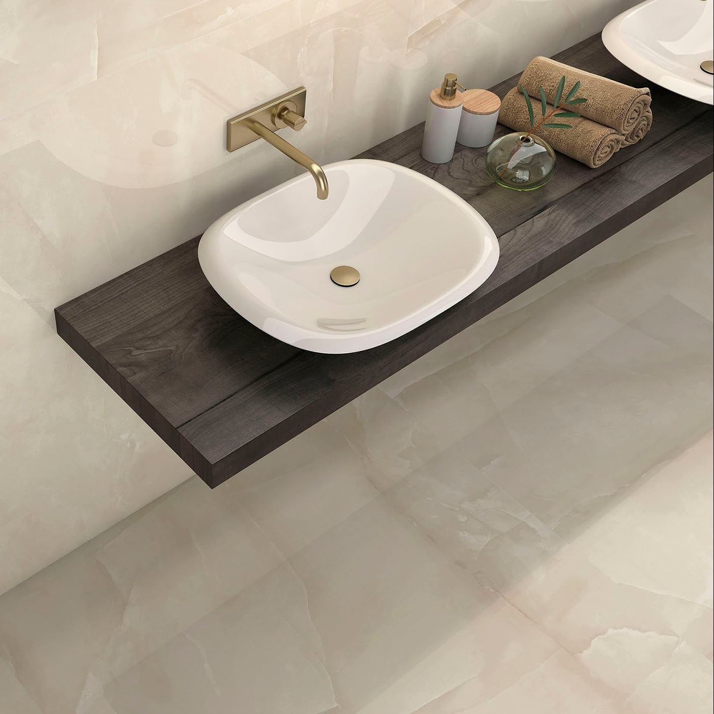 Bathroom sink with wooden shelf and decorative items on a tiled wall.